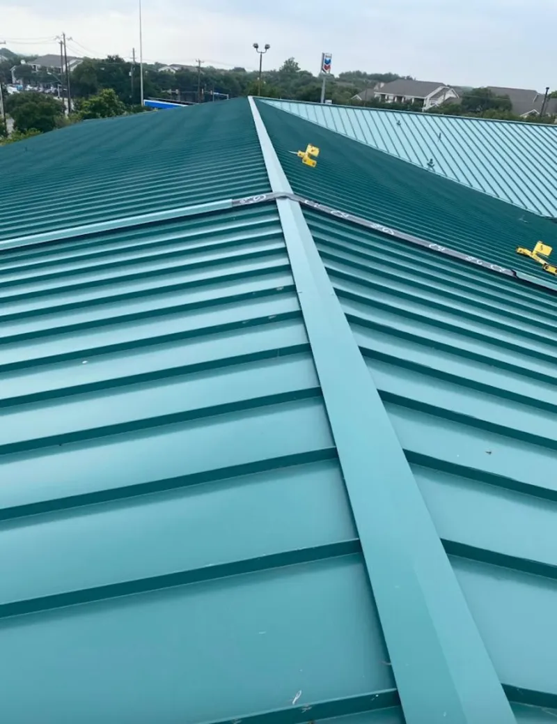Green commercial metal roof ridge and valley for Metal Roof Repair in La Porte